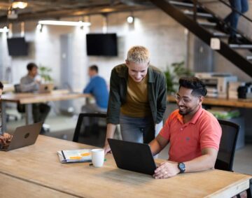 Business people working at open plan startup office